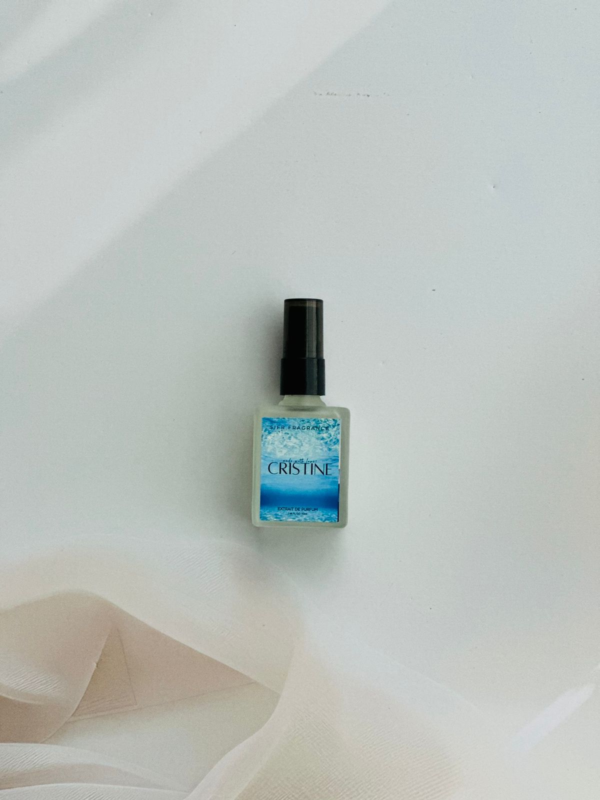 Cristine perfume with mandarin, pear, and amberwood notes